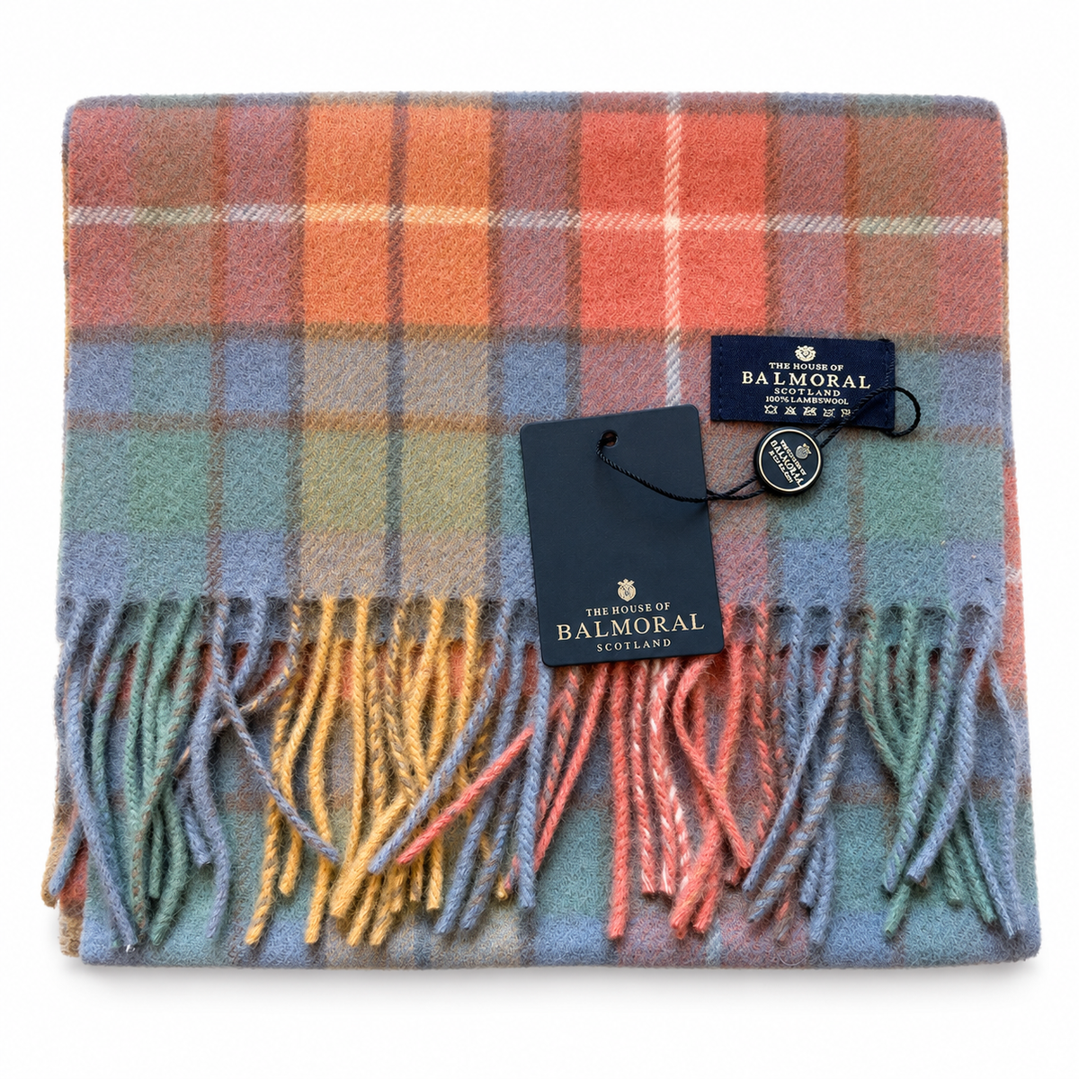     Folded Antique Buchanan lambswool scarf in coral, blue, teal and mustard tartan with Balmoral tags