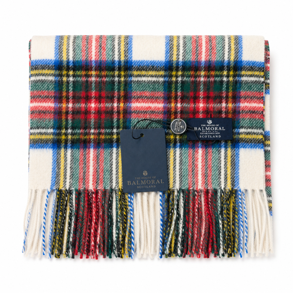 Folded Dress Stewart tartan lambswool scarf featuring red, green, blue and yellow checks with fringed ends