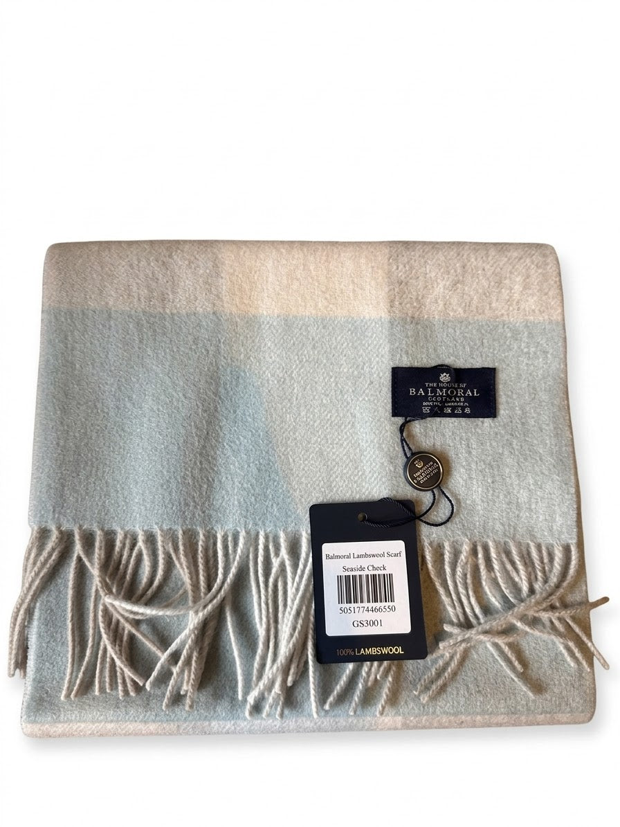 Folded Seaside Check 100% lambswool scarf by The House of Balmoral in soft blue, beige and cream with fringed ends
