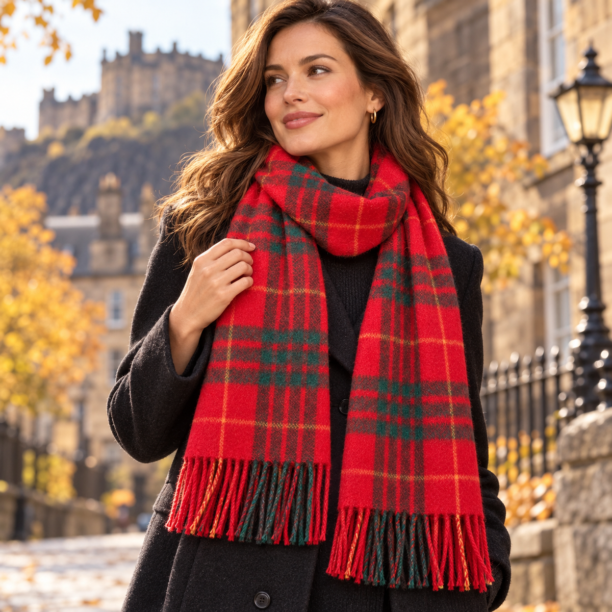 Woman wearing a Fraser Scott Cameron Modern red tartan lambswool scarf outdoors in Edinburgh