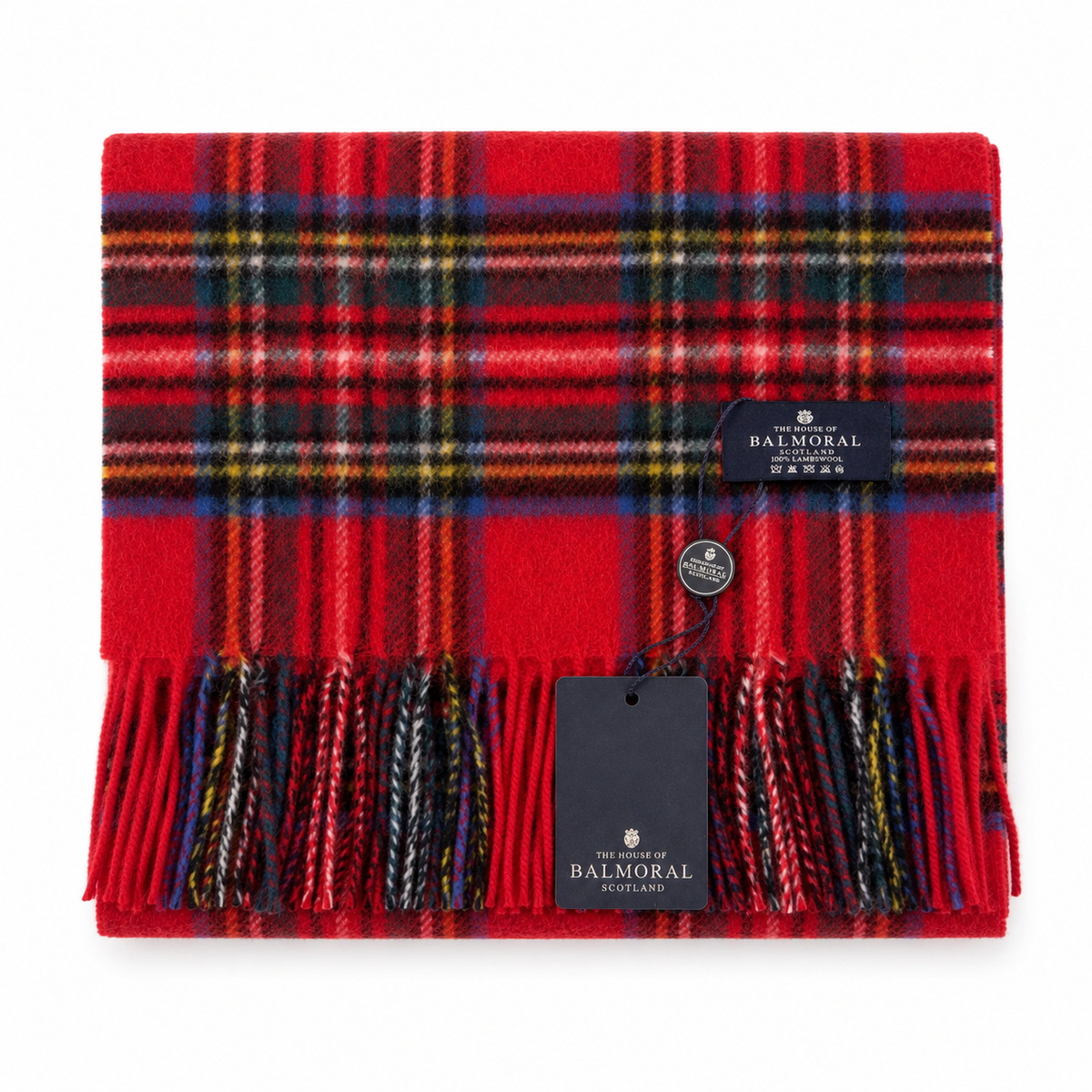 Folded Royal Stewart red tartan lambswool scarf with fringed ends and House of Balmoral tags