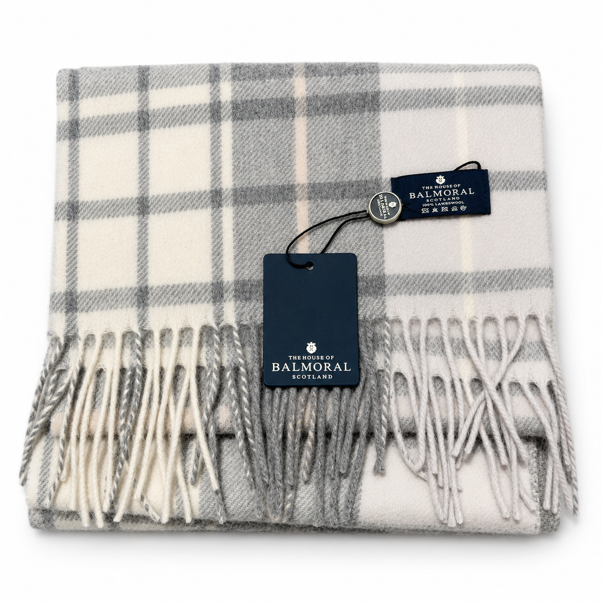     Folded Balmoral Lilac Check lambswool scarf in ivory, soft grey and pale lilac with tags