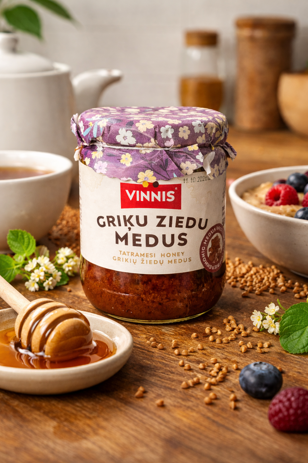 Vinnis Buckwheat Honey 300g served with tea and honey dipper – thick dark honey texture close up